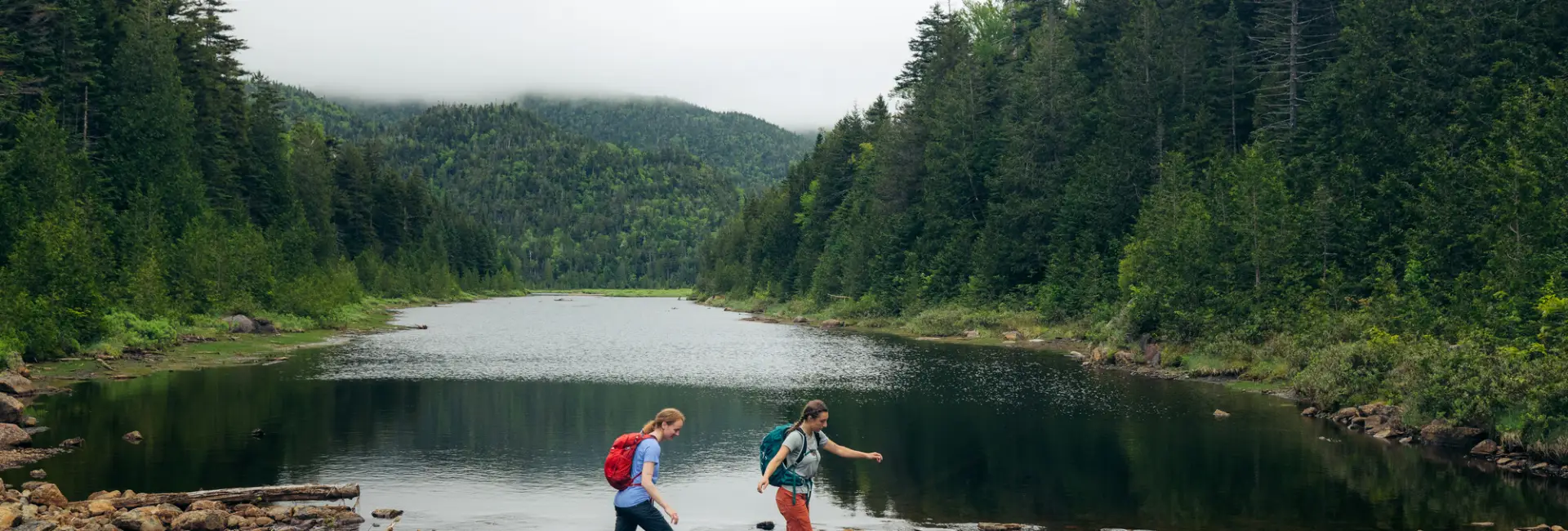 two people crossing the water