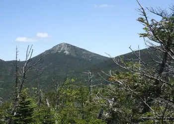 This is Mount Redfield from a distance., The view from the summit in winter is stunning., The summer trail has many scenic attractions., Look for the sign at the partly treed summit., Snowy beauty guaranteed&#44; on the trail or at the summit.