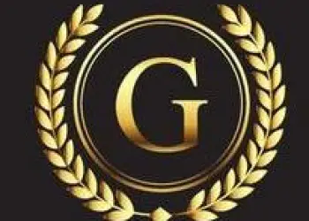 A gold G in the center of a circle ringed with olive leaves.