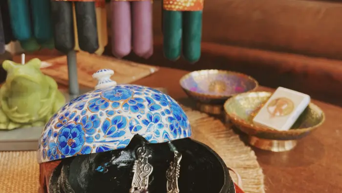 Jewelry in a blue and white ceramic dish