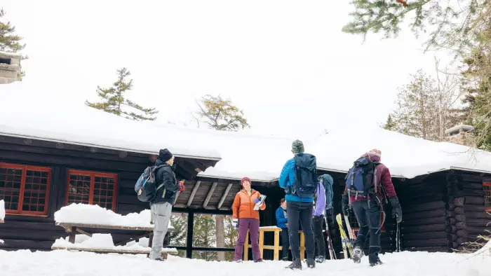 group of people in front of great camp