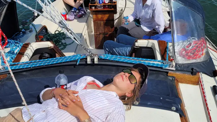 Person relaxing on sailboat