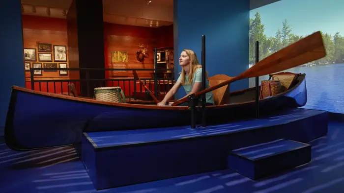A woman rows a display boat