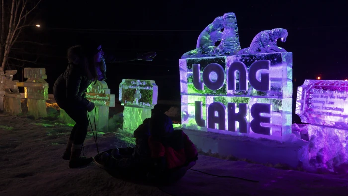 An ice sculture with the words Long Lake