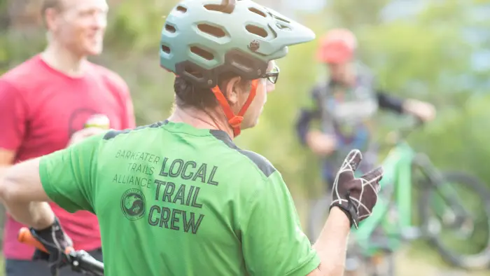 Trail crew chatting with people