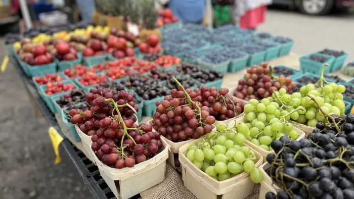 a table with a variety of fruit- grapes