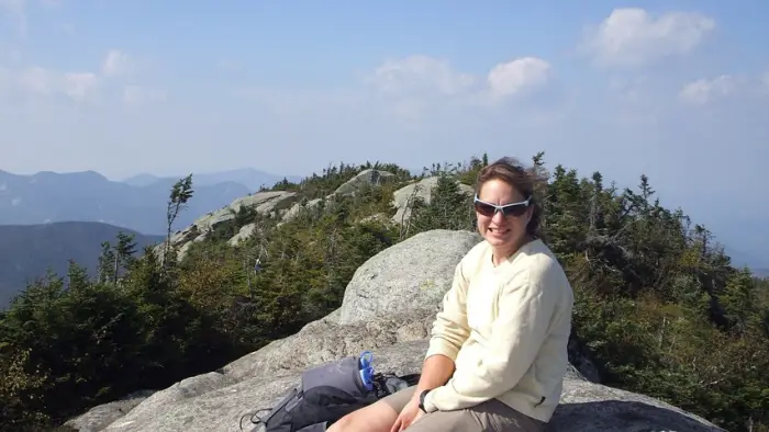 Celebrating the summit of Dix Mountain on a summer day.