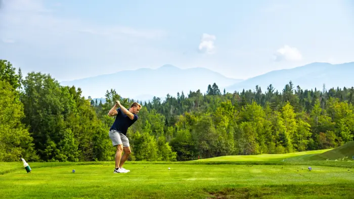 man swinging a golf club