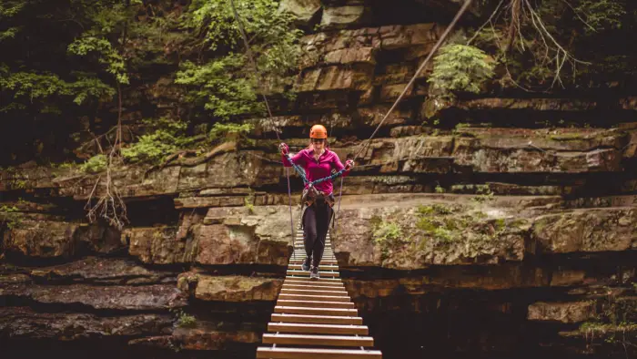 Take a daring walk across a wooden bridge to give unique perspective on the chasm