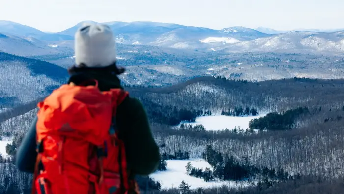 A hiker enjoying the view of frozen ponds from Moxham