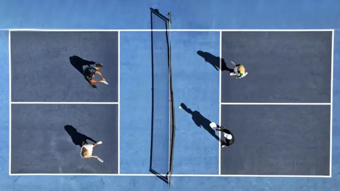 Aerial view of 4 people on a pickle ball court