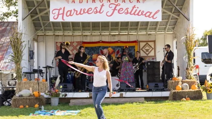 Woman dances to music at the Adirondack Harvest Festival