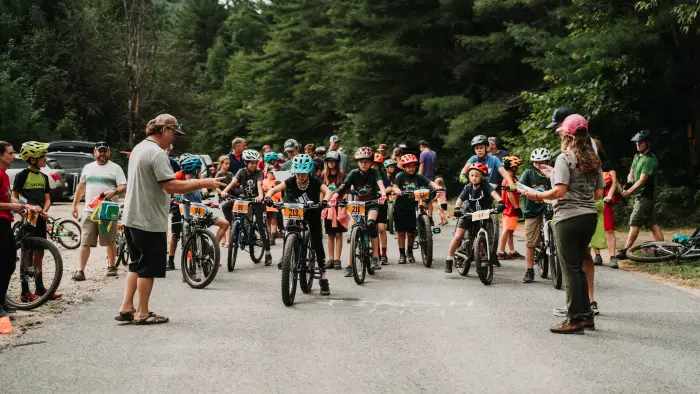 Kids line up for Mountain Bike race on bikes
