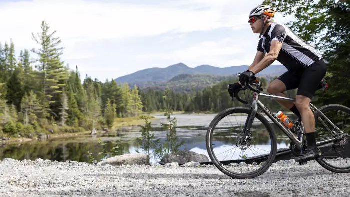 A biker on a causeway in the mountains