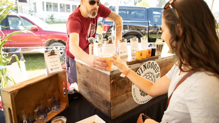 A woman served beer