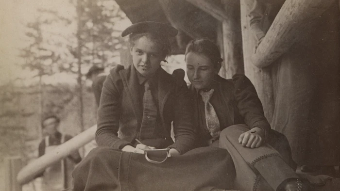 Two woman back in Camp Santanoni