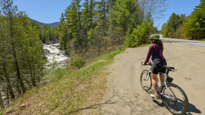 A cyclist enar a waterfall