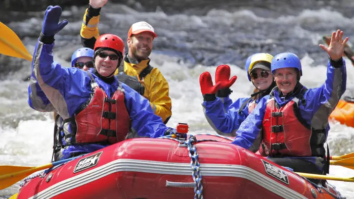 A group of people in a whitewater raft