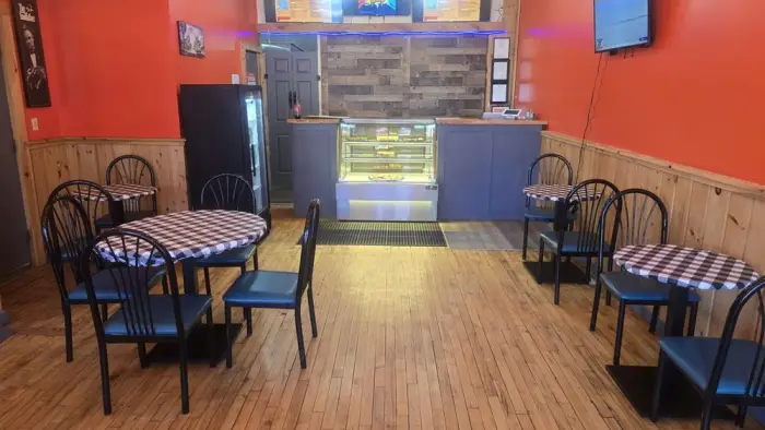Red interior of the dining space and counter of Vita Lago.