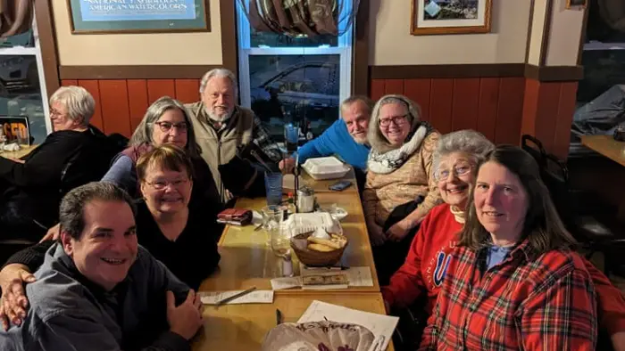Adirondack Hotel with many snowmobiles parked outside