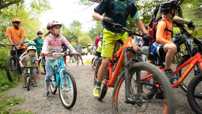 Group of colorful outfits and bikes with participants of all ages