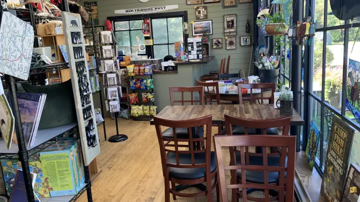  art prints and fresh foods on shelves.