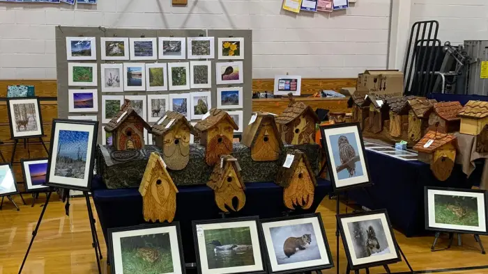 Booth of hand made bird houses and nature photography