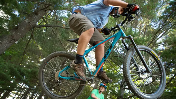 Jumping a bike in the woods