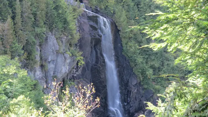 A long and narrow waterfall seen from an overlook