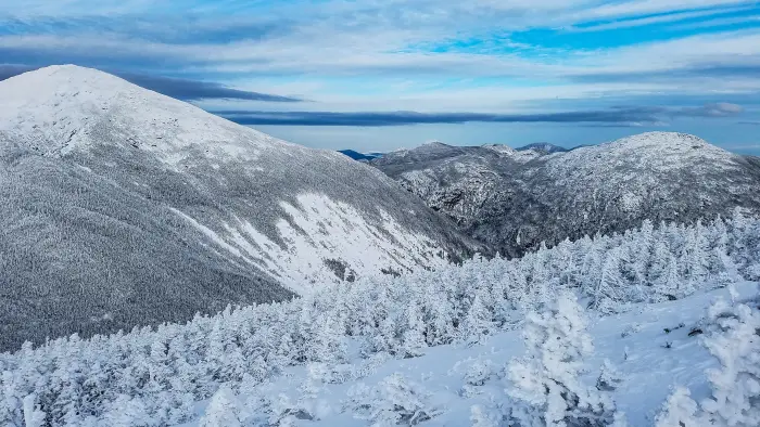 A view of snow-covered mountains under foreboding clouds