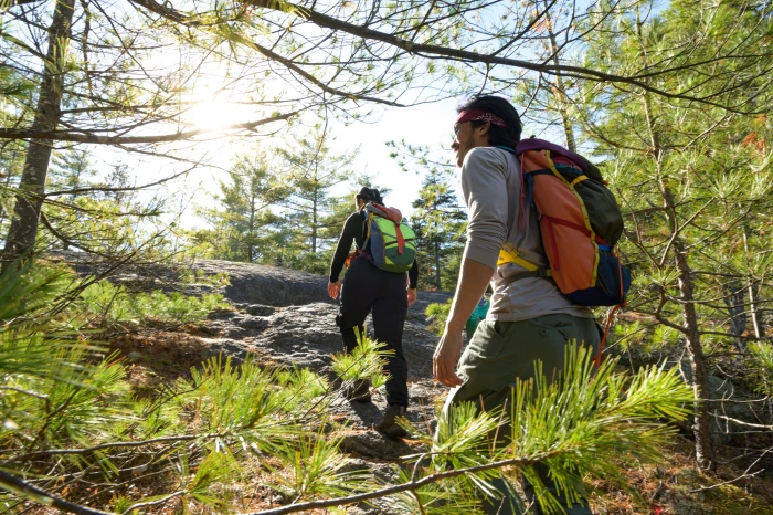 Two hikers bask in the sun along the trail to Treadway Mountain