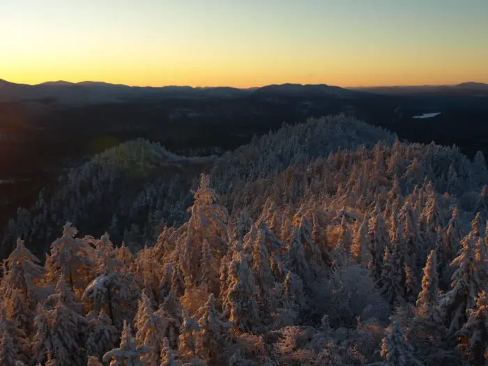 A view of stunning winter vistas from the top of Goodnow Mountain.