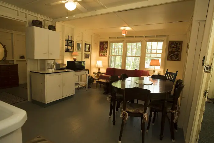 Interior of a rustic cottage with antique furnishings.