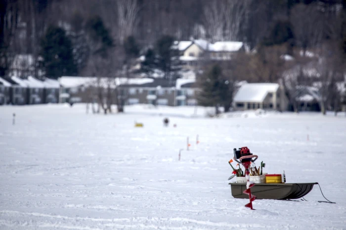 Must-have tools include fishing rigs (popups are popular) and an ice auger to drill the hole.