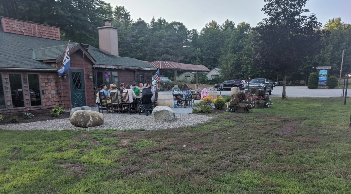 People seated at tables on an outdoor patio