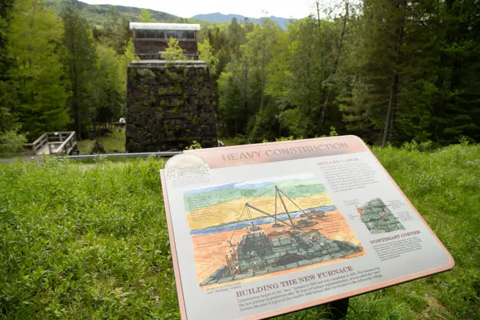 Looking out at interpretive panels and blast furnace in the Upper Works