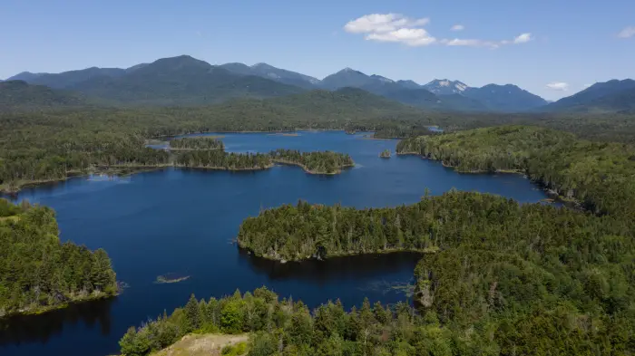 A birds eye view of the Boreas Ponds with the mountains in the background