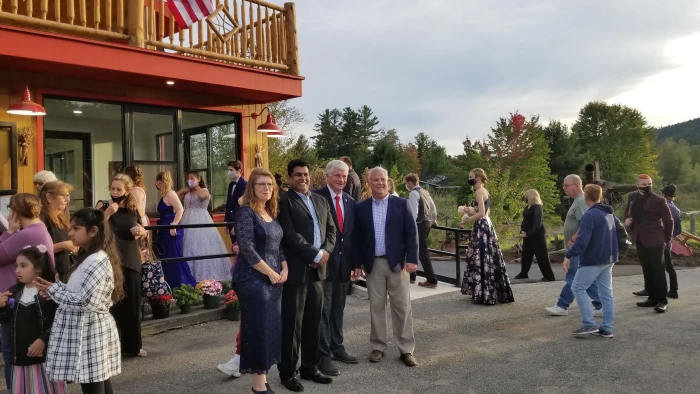 Frontier Town Gateway owner Mo Ahmad poses for photos in front of his business.