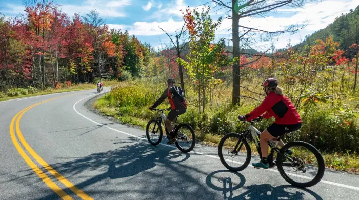 Two people biking around the Adirondacks