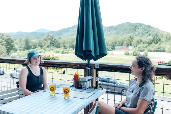 Two women enjoying a meal at Paradox Brewery