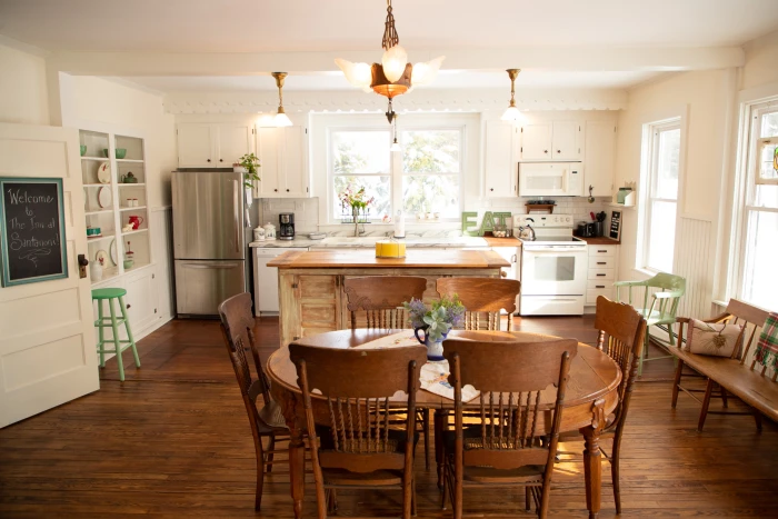 A bright white kitchen with a country style interior.