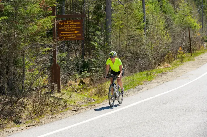 A cyclist rides on Blue Ridge Road in Newcomb