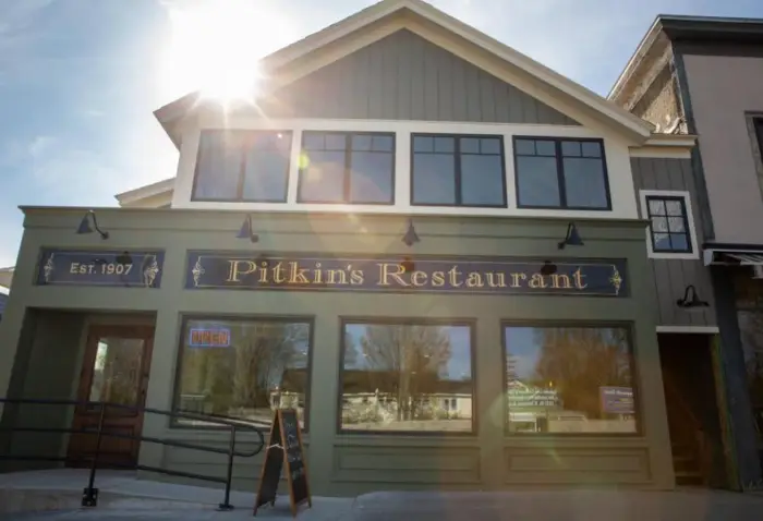 The entrance of Pitkin's Restaurant on a sunny day.