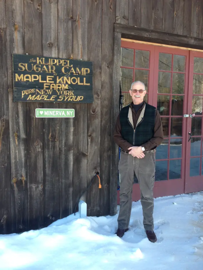 Klippel in front of the Maple Knoll Sugar House.