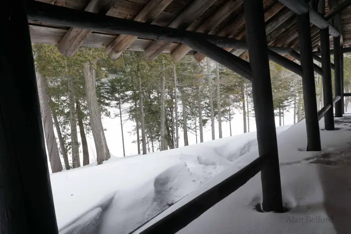 The deep snow was drifted against the porch as I looked out over Newcomb Lake.