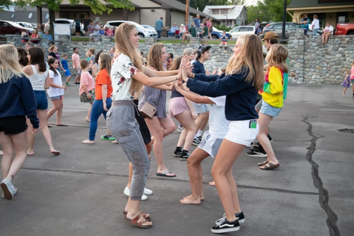 Many people of all ages enjoy square dancing.