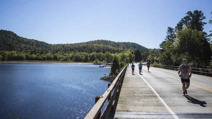 Adk Distance Marathon participants running along Schroon Lake